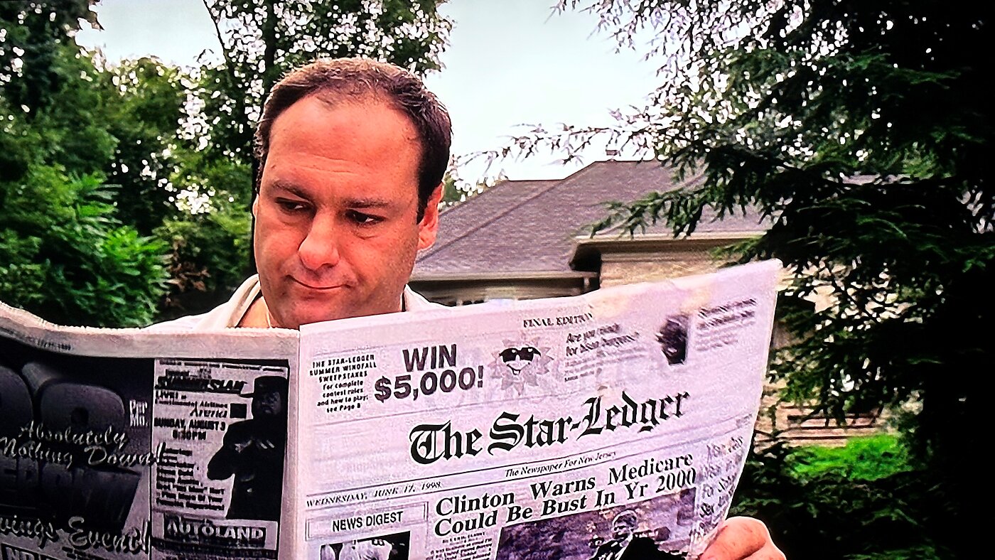A legitimate businessman enjoys his morning paper.